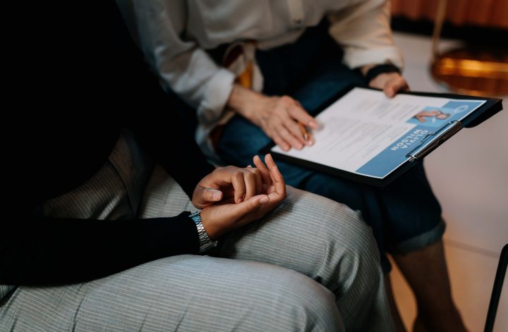 people looking at a resume